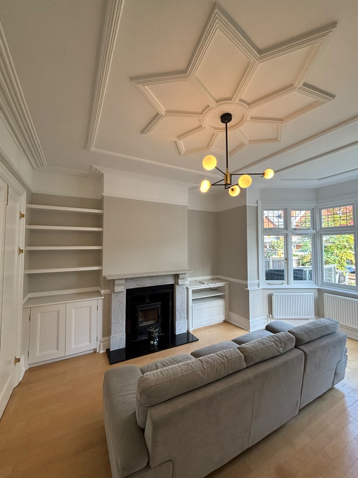 Reception room with star ceiling and marble fireplace